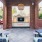 an outdoor seating area with a tv and fireplace