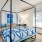 a bedroom with a bed and a desk