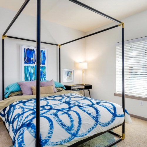 Relax and recharge in beautiful and spacious bedrooms a bedroom with a bed and a desk