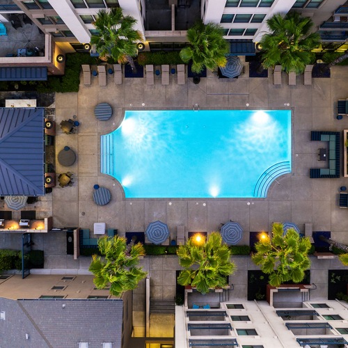 Love where you live aerial view of a pool in a courtyard