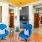 a lunge area with blue chairs